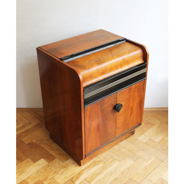 This cabinet, produced in 1957, was originally designed as a storage unit for a record player, with the upper section...
