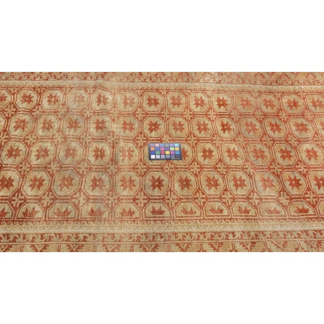 City in western China (Xinjiang Province), active since the 18th century. Moderate weave on cotton. Long rugs (k'ang...