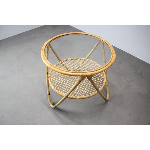 Vintage designer coffee table by Alan Fuchs manufactured in Czechoslovakia during the 1960s. The table features an elegant...