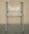 This is a very cool over engineered acrylic glass and steel folding chair with swinging back rest A very well made chair,...