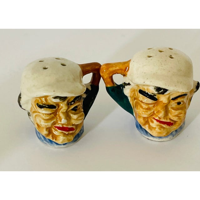 Vintage pair of salt and pepper shakers .