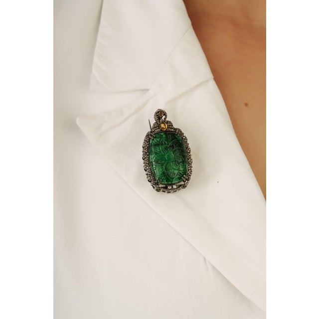 This exquisite Aventurine, citrine, and diamond brooch pendant is crafted in 925 sterling silver, featuring a beautifully...