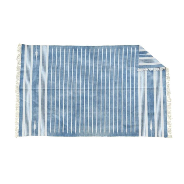 Made from naturally dyed 100% cotton yarn, these dhurrie rugs have been handwoven by skilled craftsmen in Jaipur. The age...