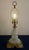 An exceptional mid-century Hollywood Regency accent lamp featuring a sculptural, tiered opaline milk glass column that...