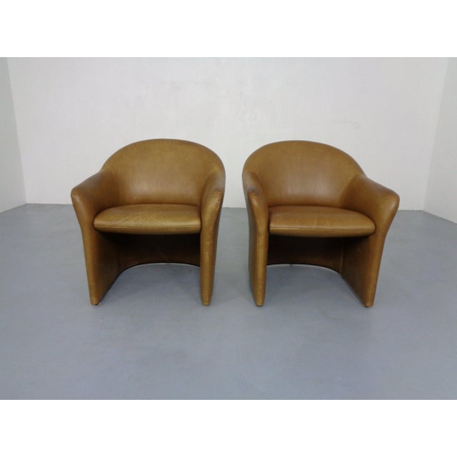 A pair of minimalist leather armchairs by Walter Knoll from the 1960s. This piece has an attribution mark, I am sure that...