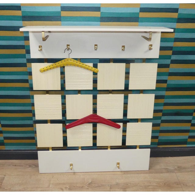 Decorative Highlight 70s Coat Rack in a Stunning Design! Framed at the top and bottom by white-coated MDF panels, the...