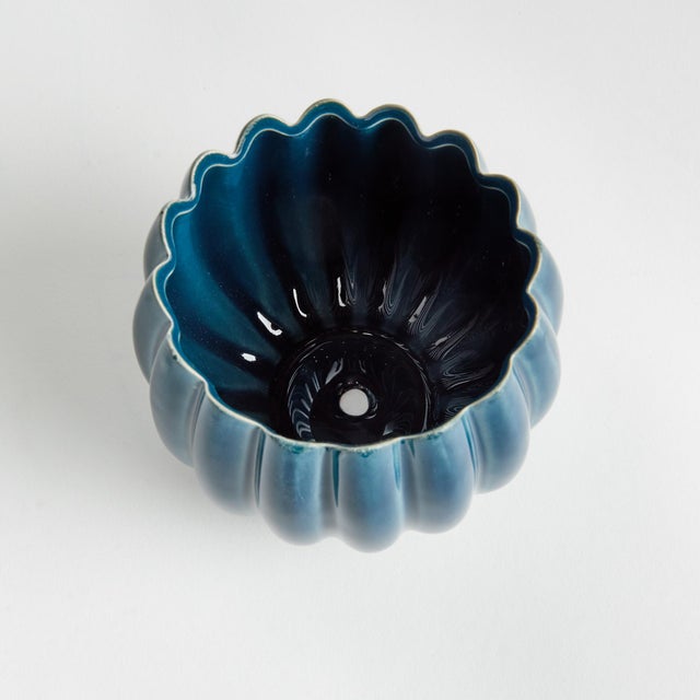 With rounded form, petallike details and thickly applied glaze, this natureinspired pot is extraordinary. The handfinished...