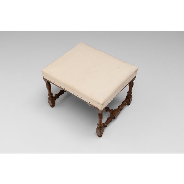 Pair of French stools on tuned walnut legs united by a turned stretcher. Circa 1920.