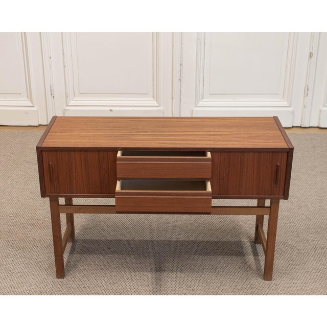 A beautifully proportioned mid-century Scandinavian entrance cabinet, designed by Bertil Fridhagen, dating from the 1950s....
