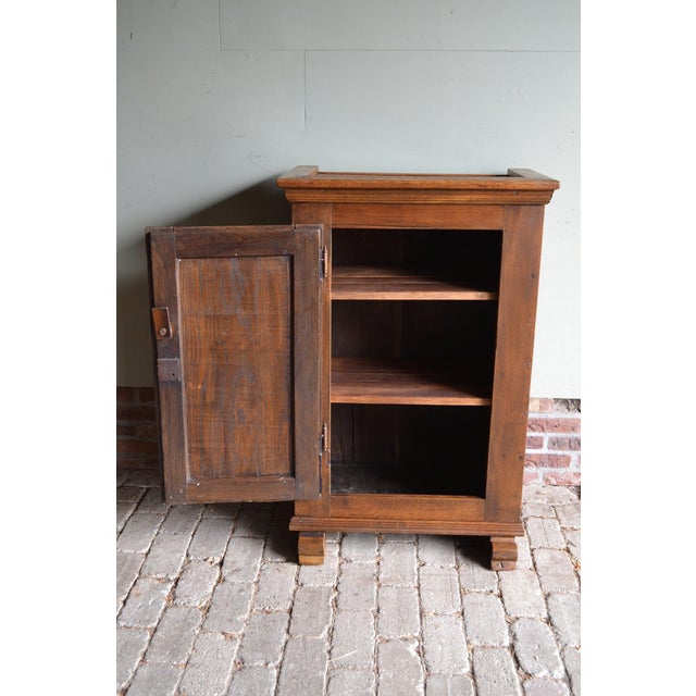 of a 19th-century German oak Spinde cabinet, bread cabinet. The height is 103 cm. The width is 76 cm. The depth is 41 cm....