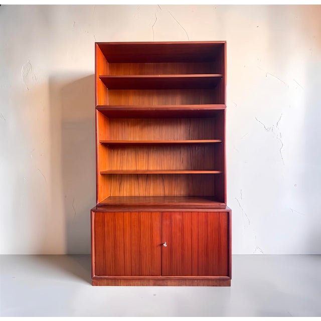 We've snagged an absolute gem from the golden age of scandinavian design: a three-piece, modular teak shelving unit, sold...
