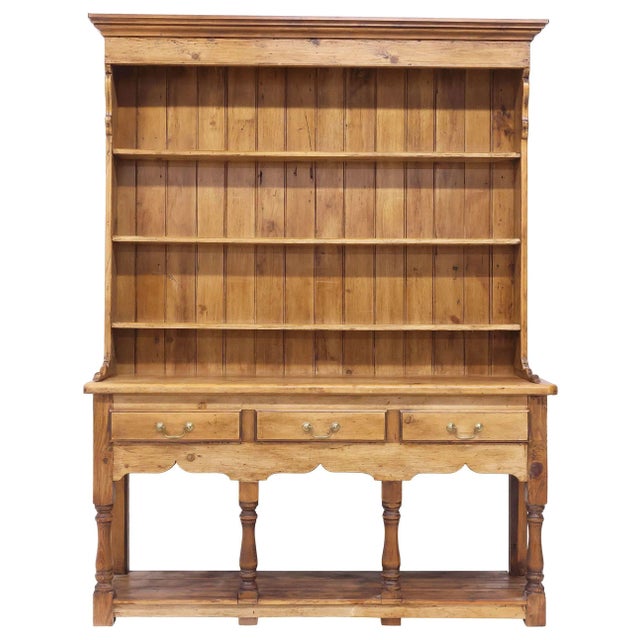 A beautifully preserved 19th century English pine dresser, retaining its warm, honeyed patina and honest country...