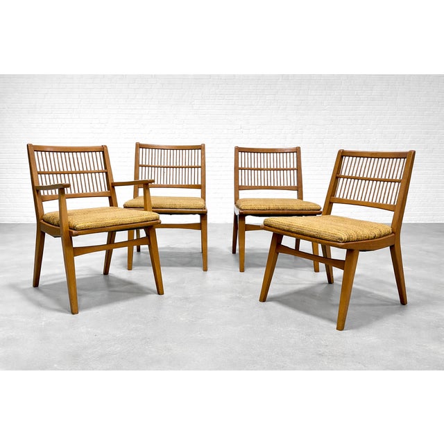 A fabulous find for MCM lovers! This set of four vintage spindle back dining chairs was crafted by the Red Lion Furniture...