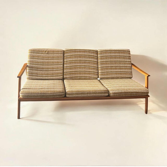 This graceful mid-century modern sofa will surprise you with its lightness. Despite its exceptional structural strength...