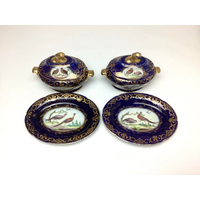 Pair Antique Coalport Porcelain Cobalt with Birds Covered Sauce Tureens With Under Plates. Each sauce measures 8 inches in...