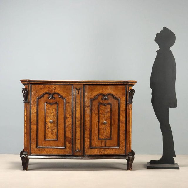 18th-century Lombard Baroque sideboard, expertly crafted from an antique chest of drawers or bureau, embodies the charm of...