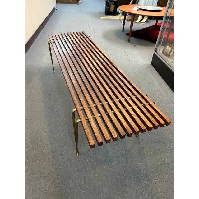 You are viewing a fantastic Walnut + Brass Slat Bench, designed by Hugh Acton c1960s. The design features twelve 58" long...
