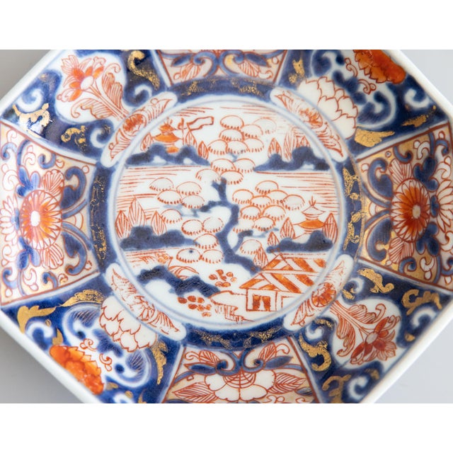 A gorgeous petite 19th-Century Japanese Imari porcelain plate or dish hand painted in the traditional Imari colors. It has...