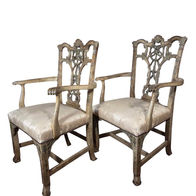 This pair of armchairs is from the Hickory Chair Company and called Emma. They have an ornately carved wood frame with...