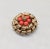 1950s round goldtone two layered circles of curled goldtone with beads of faux-coral and ribbed goldtone bead center...