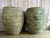 A magnificent pair of colossal Mediterranean-style barrel-form olive jars, offering monumental scale and an extraordinary...