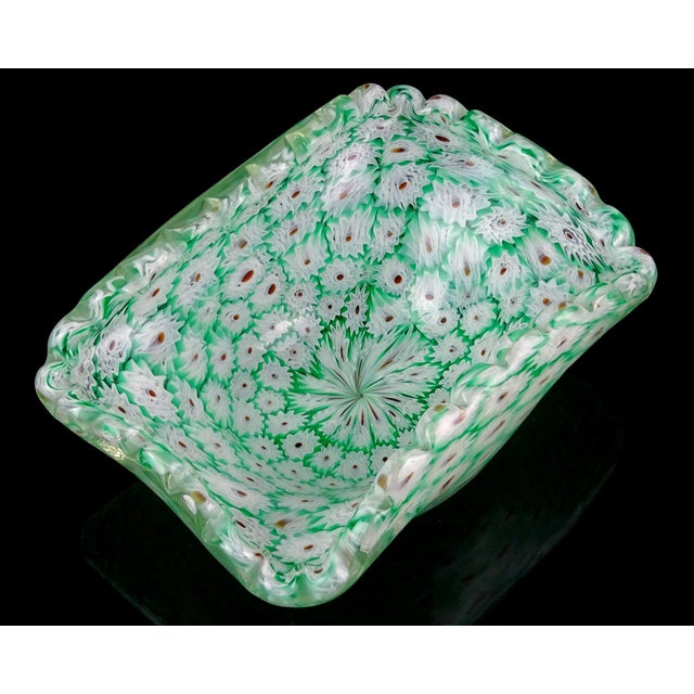 Beautiful Murano hand blown green and white millefiori flower mosaic Italian art glass scalloped rim decorative bowl. The...
