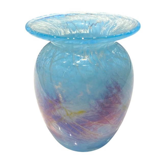 This Michael Nourot signed vase features a beautiful mix of blue and lavender tones, with soft, swirling patterns that...