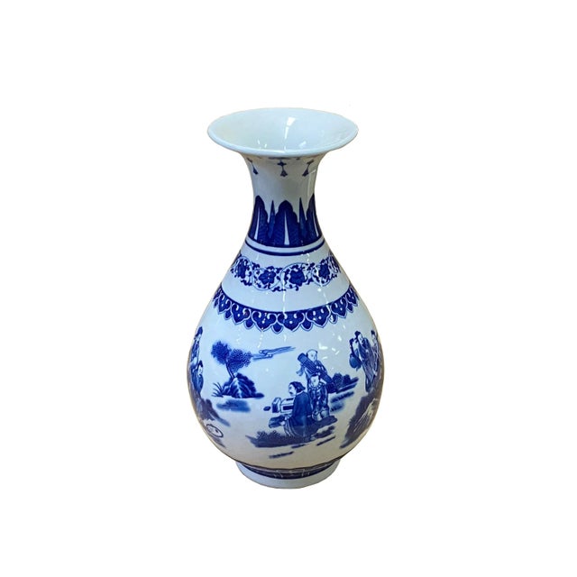 This is an oriental Chinese vase with a white base and blue color oriental people scenery graphics. Dimensions: Dia 6.5" x...