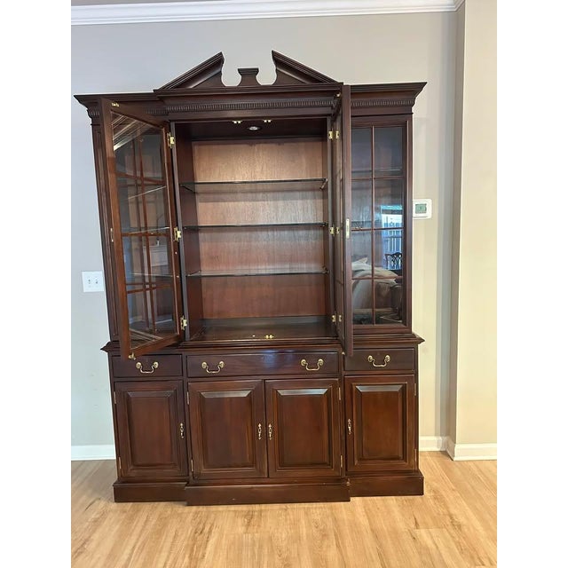 Beautiful solid wood Lexington china cabinet with glass display doors and built-in lighting. Classic traditional style...