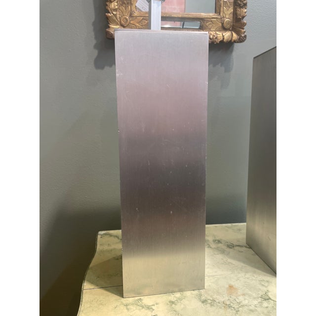 Stylish pair of vintage aluminum table lamps with green felt bottom. Brushed aluminum in a rectangular shape