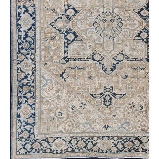 Intricately designed geometric Persian Heriz carpet. Antique Persian Heriz Rug with Geometric Medallion Design in Taupe,...