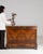 A refined Biedermeier chest of drawers characterized by clean lines, balanced proportions, and understated elegance. The...