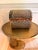Small vintage Asian-style woven bamboo, wicker, and wood chest with a handled top and warm aged patina. The piece features...