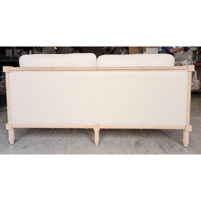 This elegant coastal transitional sofa blends timeless craftsmanship with a relaxed, sophisticated aesthetic. Upholstered...