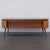 A representative desk in the spirit of Mid-Century Modern design This elegant desk from the 1950s combines flowing lines,...