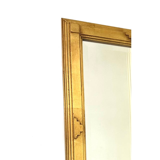 This 1980s Jay Spectre gilt wood wall mirror can be hung vertically or horizontally. The gilt wood frame is a thick 2.5”...