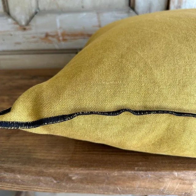 Color: Ocre; a deeper mustard yellow with brown tones, linen textured style pillow with a stitched edge, metal zipper...