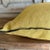 Color: Ocre; a deeper mustard yellow with brown tones, linen textured style pillow with a stitched edge, metal zipper...
