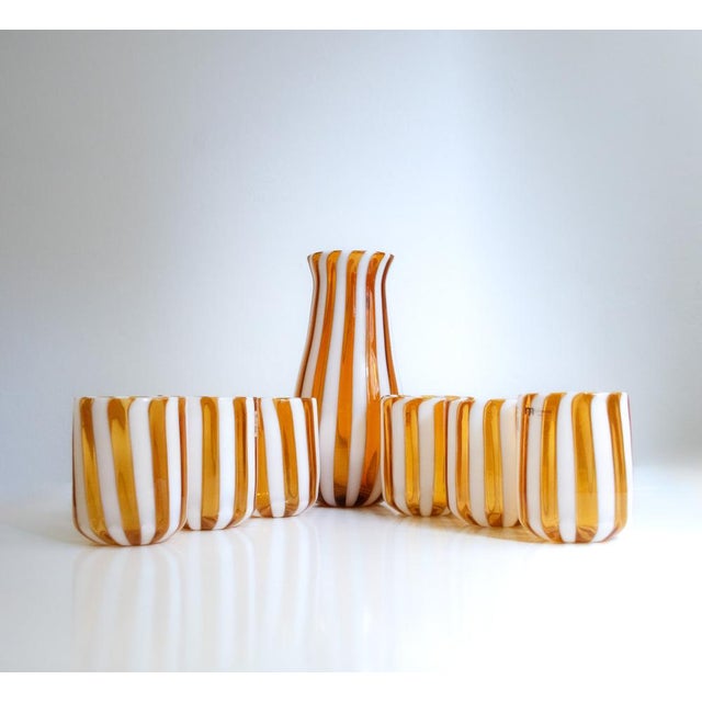 Enchanting set of glasses produced by the prestigious Nicola Moretti glassworks in Murano for Ribes the Art of Glass. They...