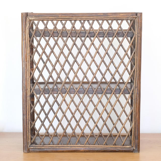 Beautiful rattan/wicker shelf, which can stand along or hung on the wall. These types of shelves are attributed to French...