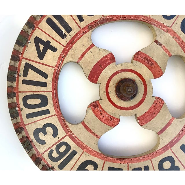 Circa 1930s two sided hand painted game wheel with cast iron center hardware. Game wheel was found in Maine. Game wheel...