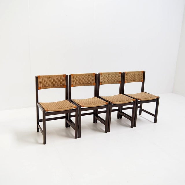 Lovely set of chairs with a wooden frame and rattan seat and back rest. The chairs dates from the 1960s and are probably...