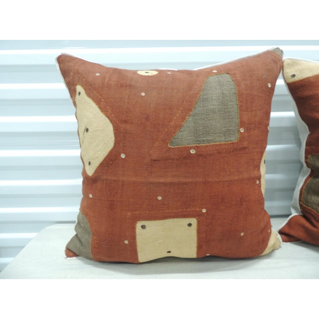 Applique African Raffia, Patchwork and Applique Brown Decorative Pillows. with, custom flat cotton trim in earth-tone...