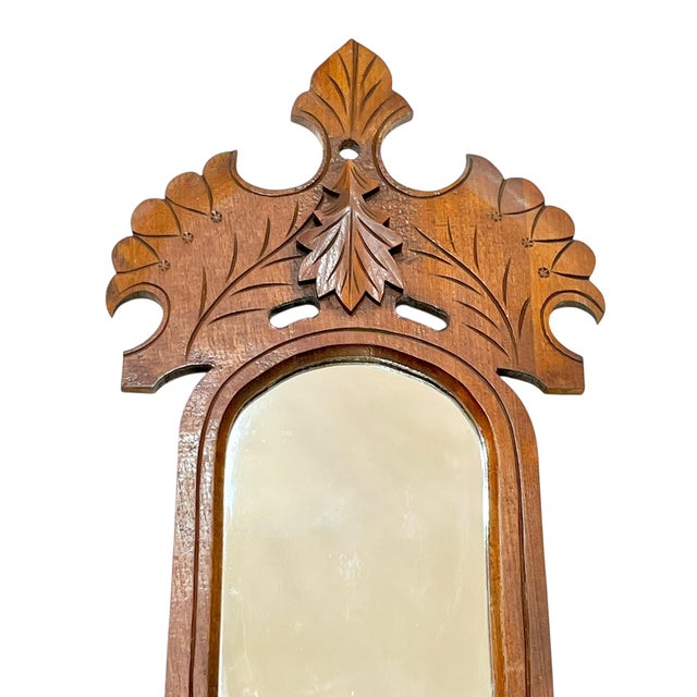 Antique tamp art hand carved mirror with candleholders and small pocket. Perfect for vintage photos or letters. Applied...