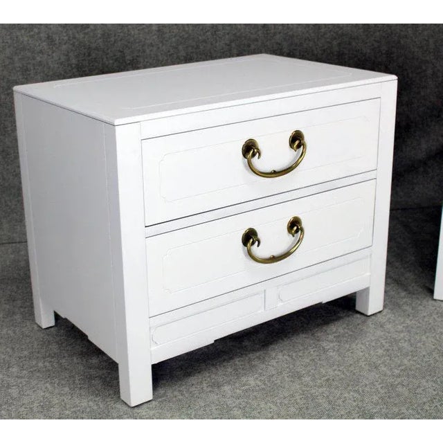 Pair of very nice white lacquer two-drawer stands, cabinets or nightstands with brass pulls. Medium gloss finish.