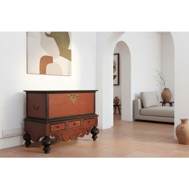 A grand example of "Colonial Baroque" furniture, this chest-on-stand hails from Ceylon, present day Sri lanka. It...