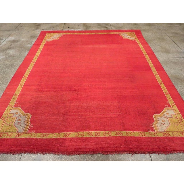 An antique Turkish Oushak room size carpet handmade during the Early 20th century. Measures: 9' 3" x 11' 5"