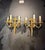Circa 1900 Caldwell gilt bronze sconces with flowers design on top, 3 lights