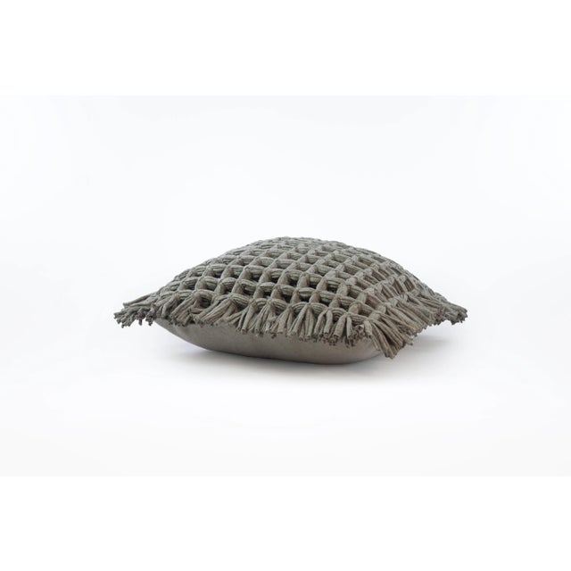 The Honeycomb cover pillow in grey is made of recycled cotton and linen from the waste of home textile products. As all...