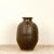 A 19th Century Japanese stoneware jar with an impressed name and small spout. Small chip to spout